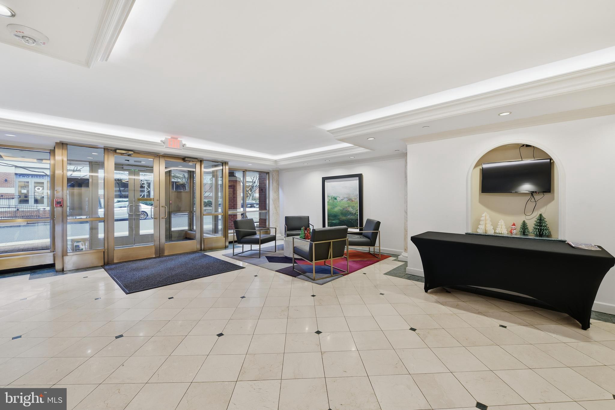 2301 N Street Northwest, Unit 212 Washington, DC 20037 - Photo 18 of 23 a living room with furniture and floor to ceiling window