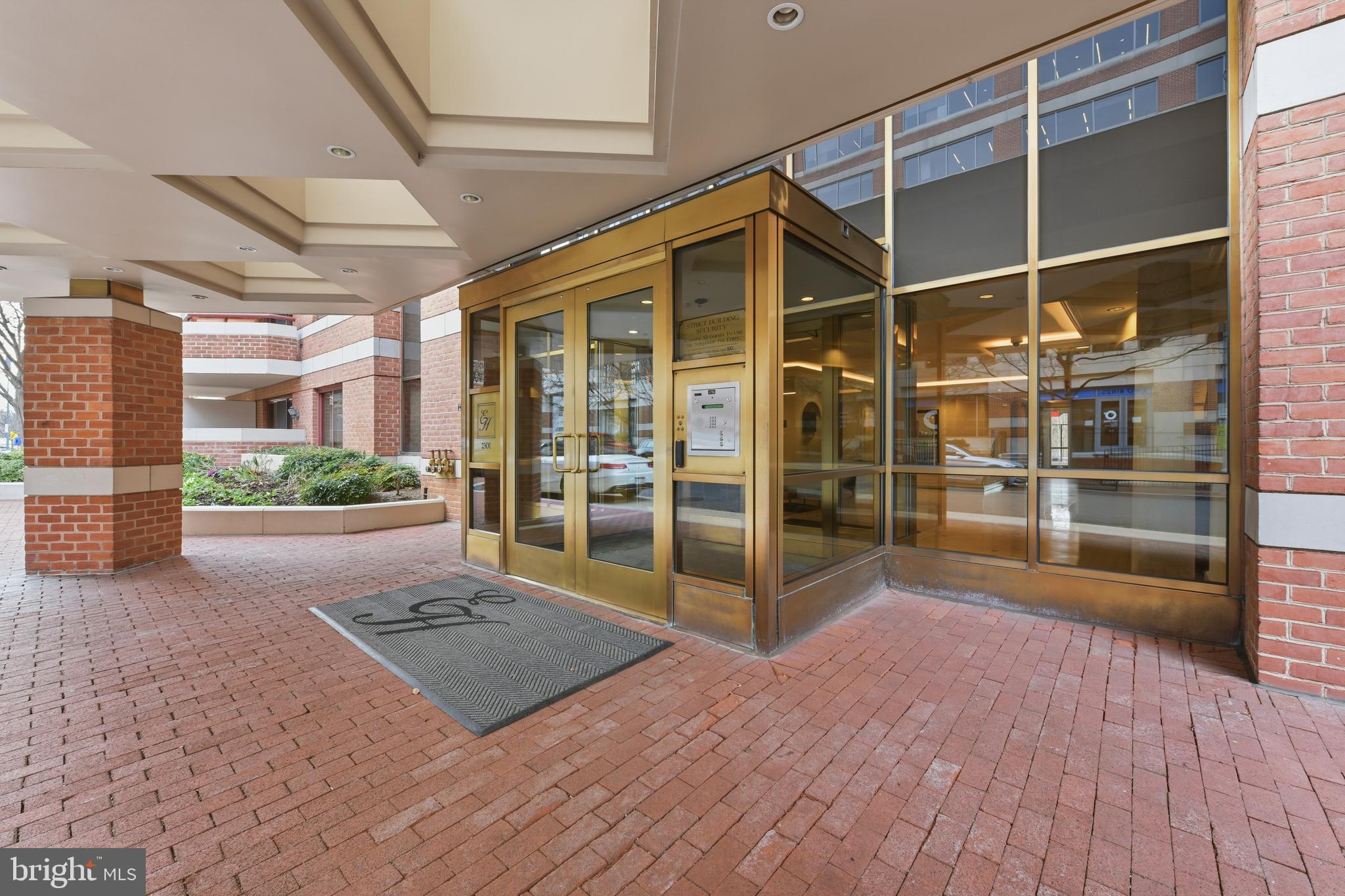 2301 N Street Northwest, Unit 212 Washington, DC 20037 - Photo 21 of 23 a view of front door and wooden floor