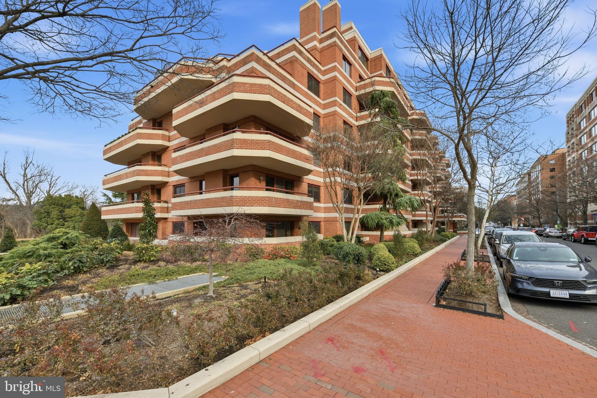 2301 N Street Northwest, Unit 212 Washington, DC 20037 - Photo 22 of 23 a view of a large building with a yard