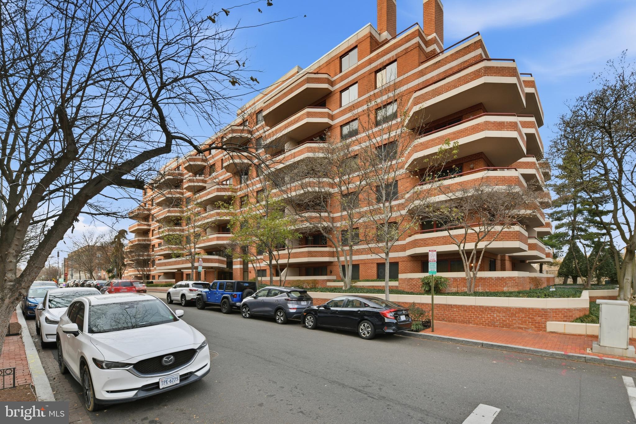 2301 N Street Northwest, Unit 212 Washington, DC 20037 - Photo 23 of 23 a car parked in front of a building