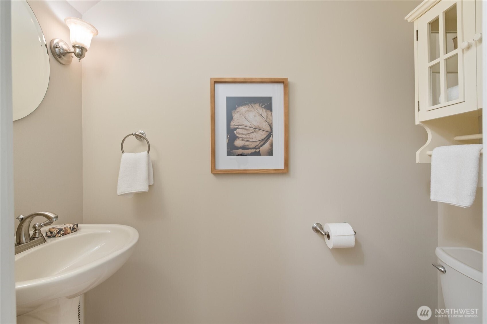 2463 26th Avenue East Seattle, WA 98112 - Photo 18 of 40 a bathroom with a sink and a mirror