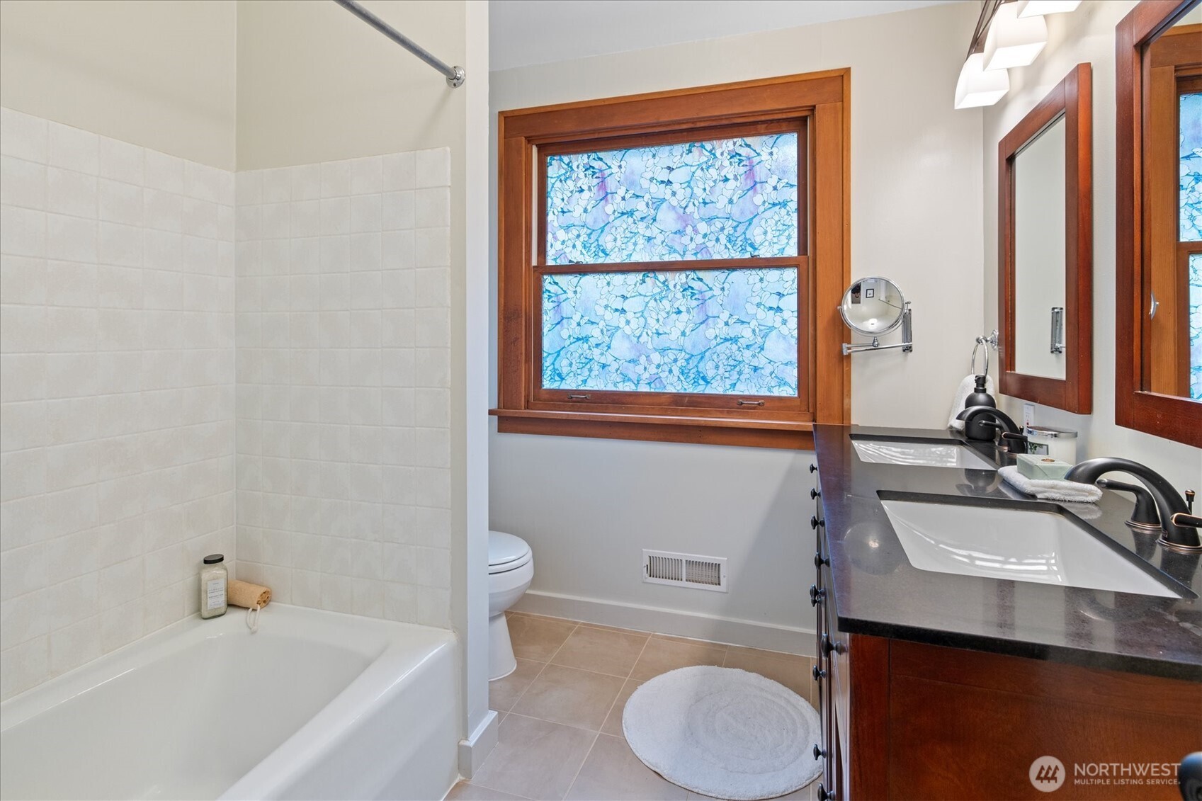 2463 26th Avenue East Seattle, WA 98112 - Photo 23 of 40 a bathroom with a sink a toilet and a tub