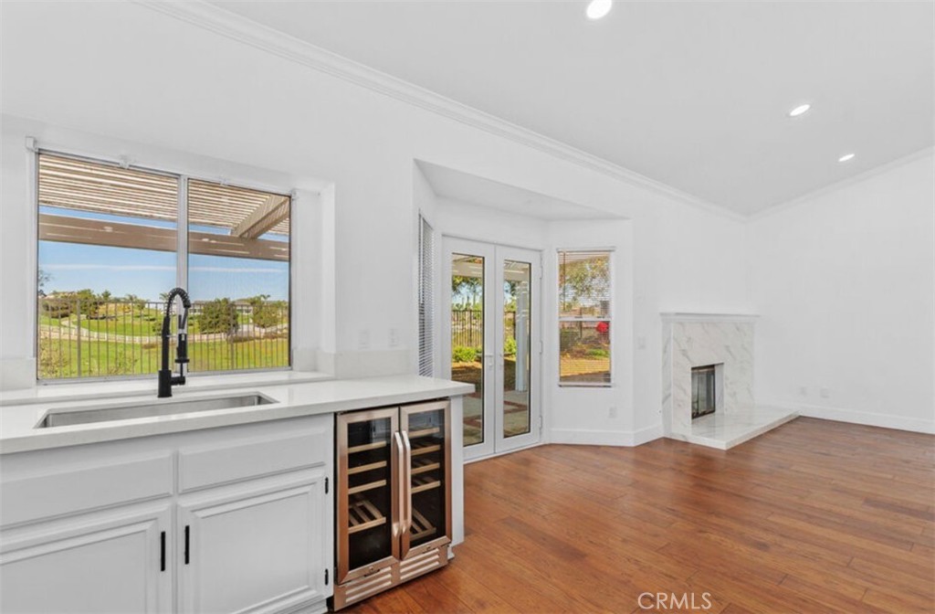 30894 Wellington Circle Temecula, CA 92591 - Photo 12 of 28 a view of an empty room with a window and wooden floor