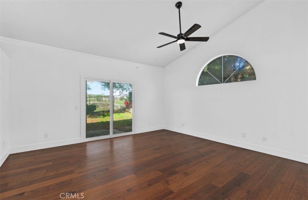 30894 Wellington Circle Temecula, CA 92591 - Photo 14 of 28 a view of an empty room with window and wooden floor