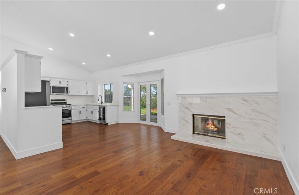 30894 Wellington Circle Temecula, CA 92591 - Photo 8 of 28 a view of a kitchen with furniture and a fireplace