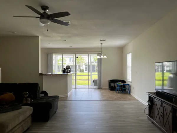 a kitchen with stainless steel appliances granite countertop a refrigerator a sink a stove and island