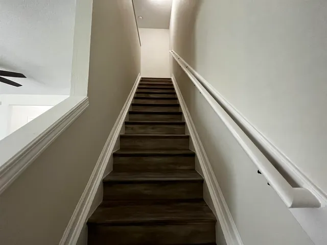 a room with furniture and a wooden floor