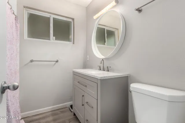 a bathroom with a toilet and a sink