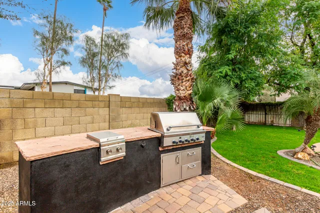 a view of a backyard with sitting area