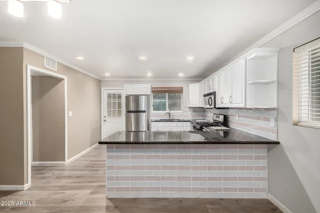 a kitchen with a sink and cabinets