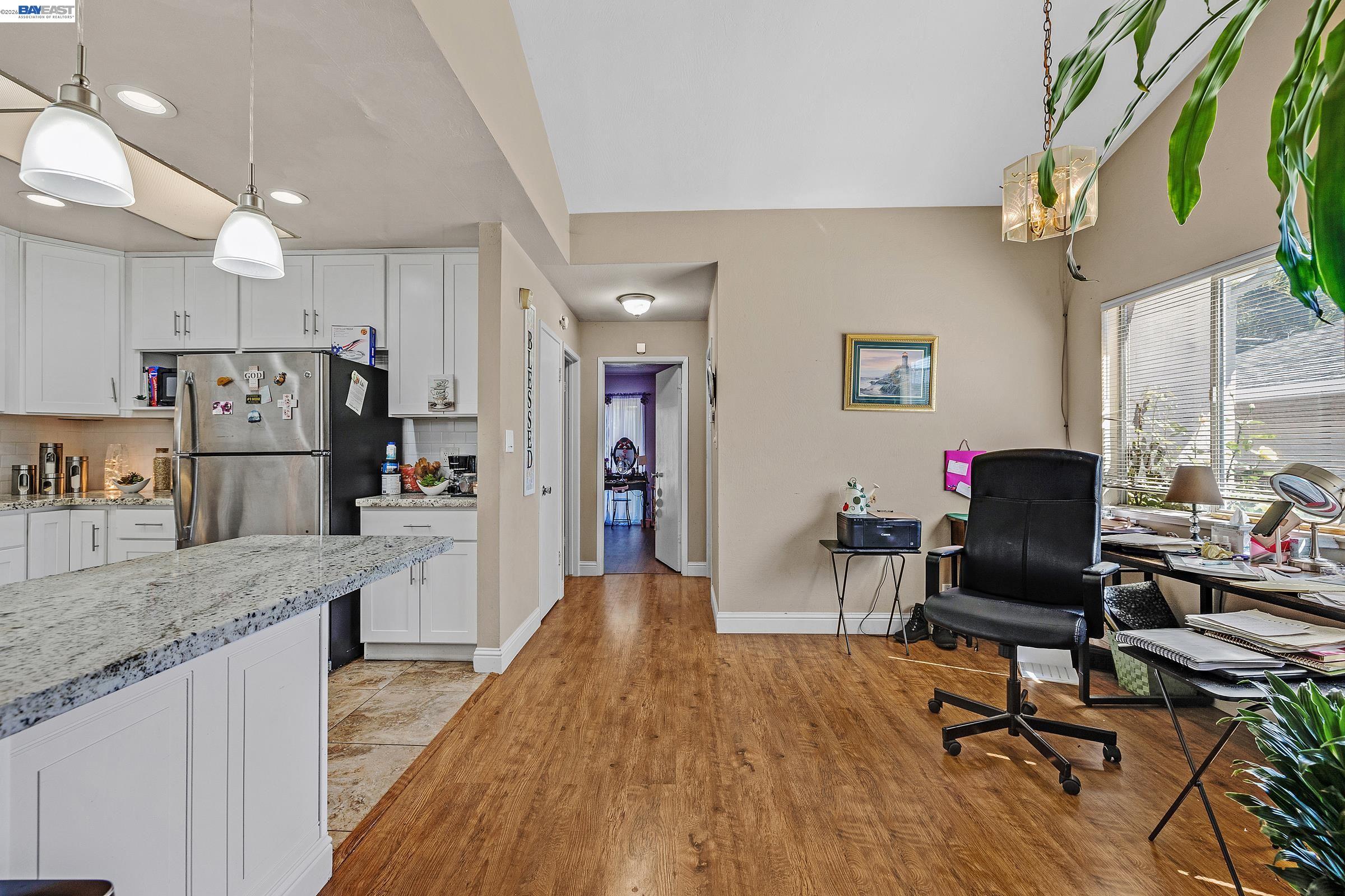 30236 Vanderbilt Street Hayward, CA 94544 - Photo 13 of 46 a living room with stainless steel appliances granite countertop furniture wooden floor and a kitchen view