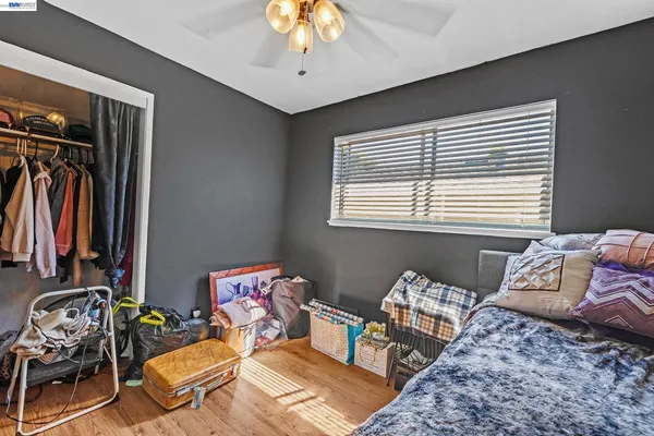 a bedroom with bed and a window