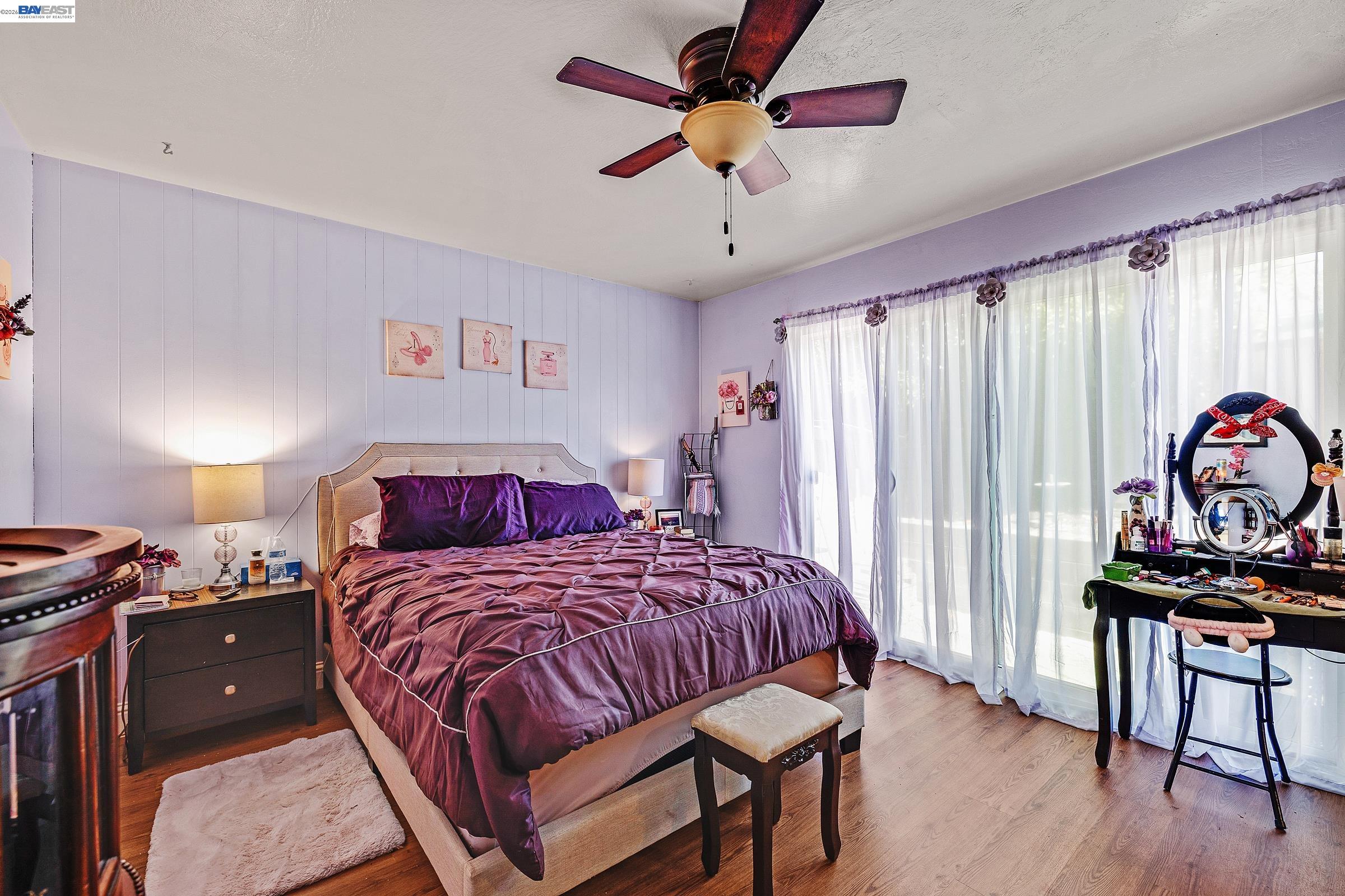30236 Vanderbilt Street Hayward, CA 94544 - Photo 3 of 46 a bedroom with a bed and a chandelier