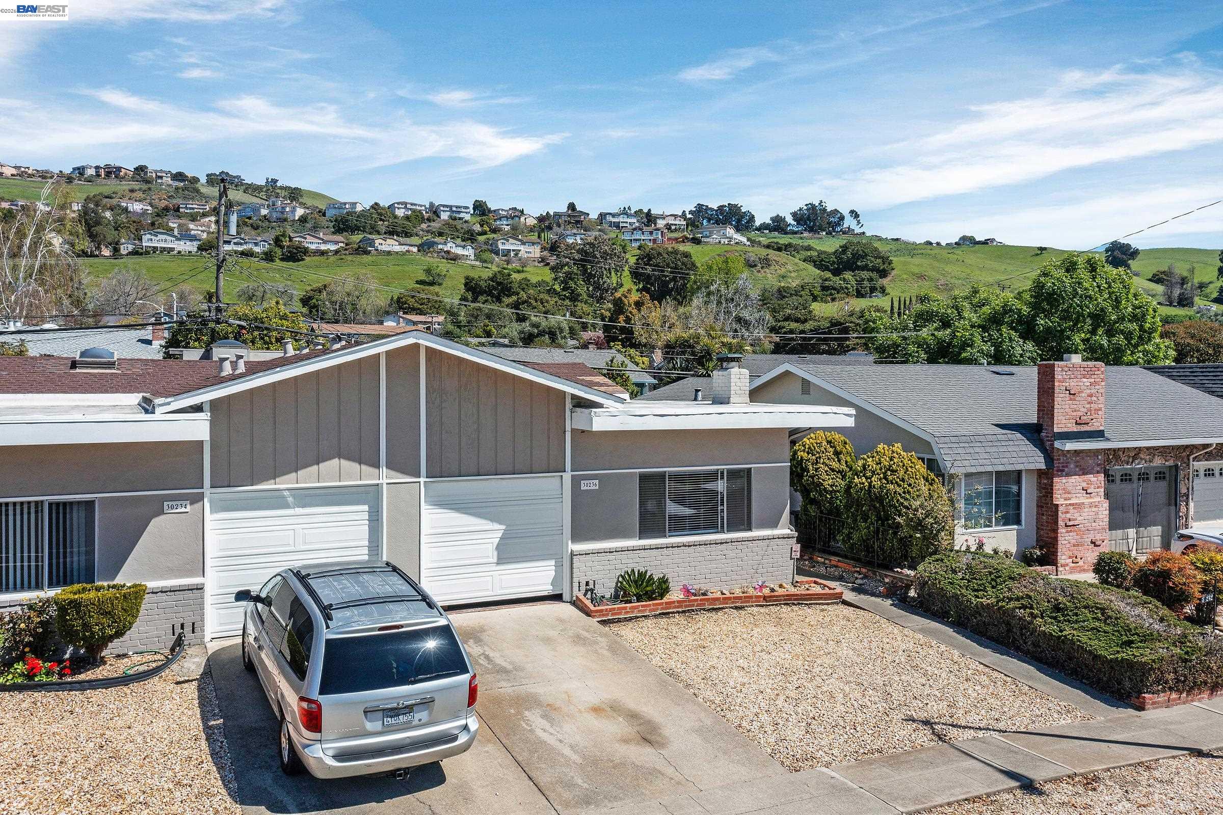 30236 Vanderbilt Street Hayward, CA 94544 - Photo 32 of 46 a front view of a house with a garden and mountain view