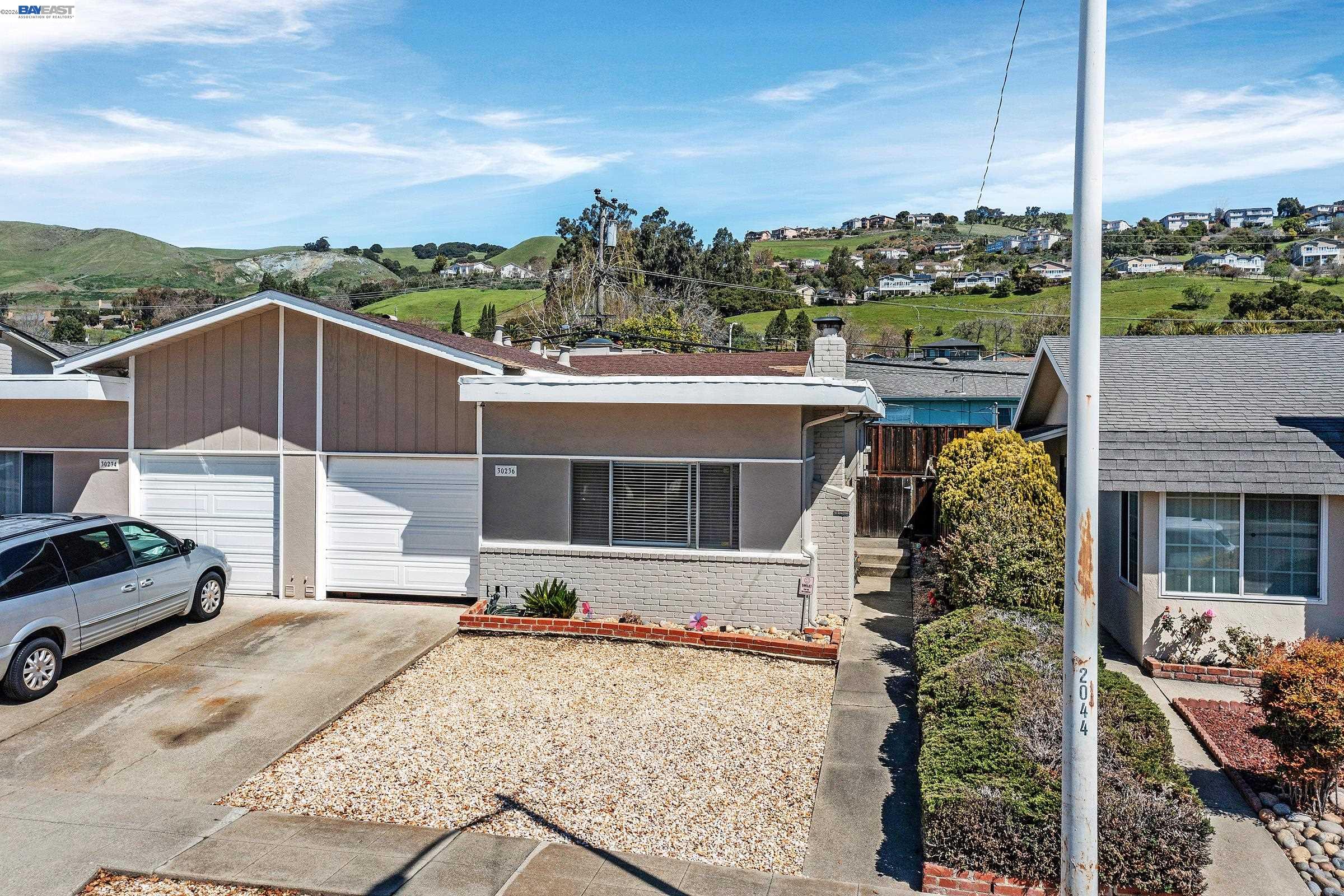 30236 Vanderbilt Street Hayward, CA 94544 - Photo 35 of 46 a front view of a house with a yard and mountain view