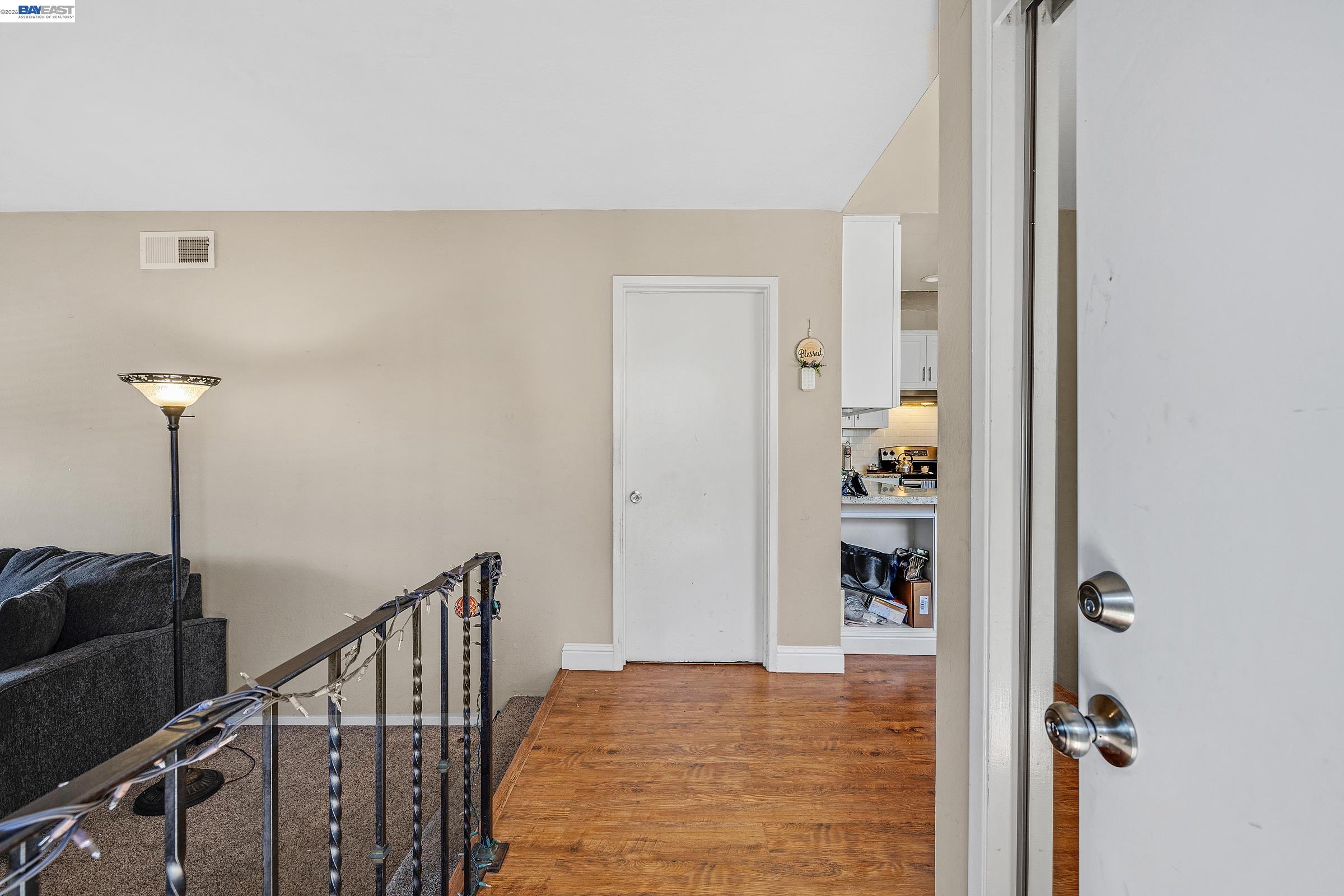 30236 Vanderbilt Street Hayward, CA 94544 - Photo 36 of 46 a view of a hallway with wooden floor and staircase