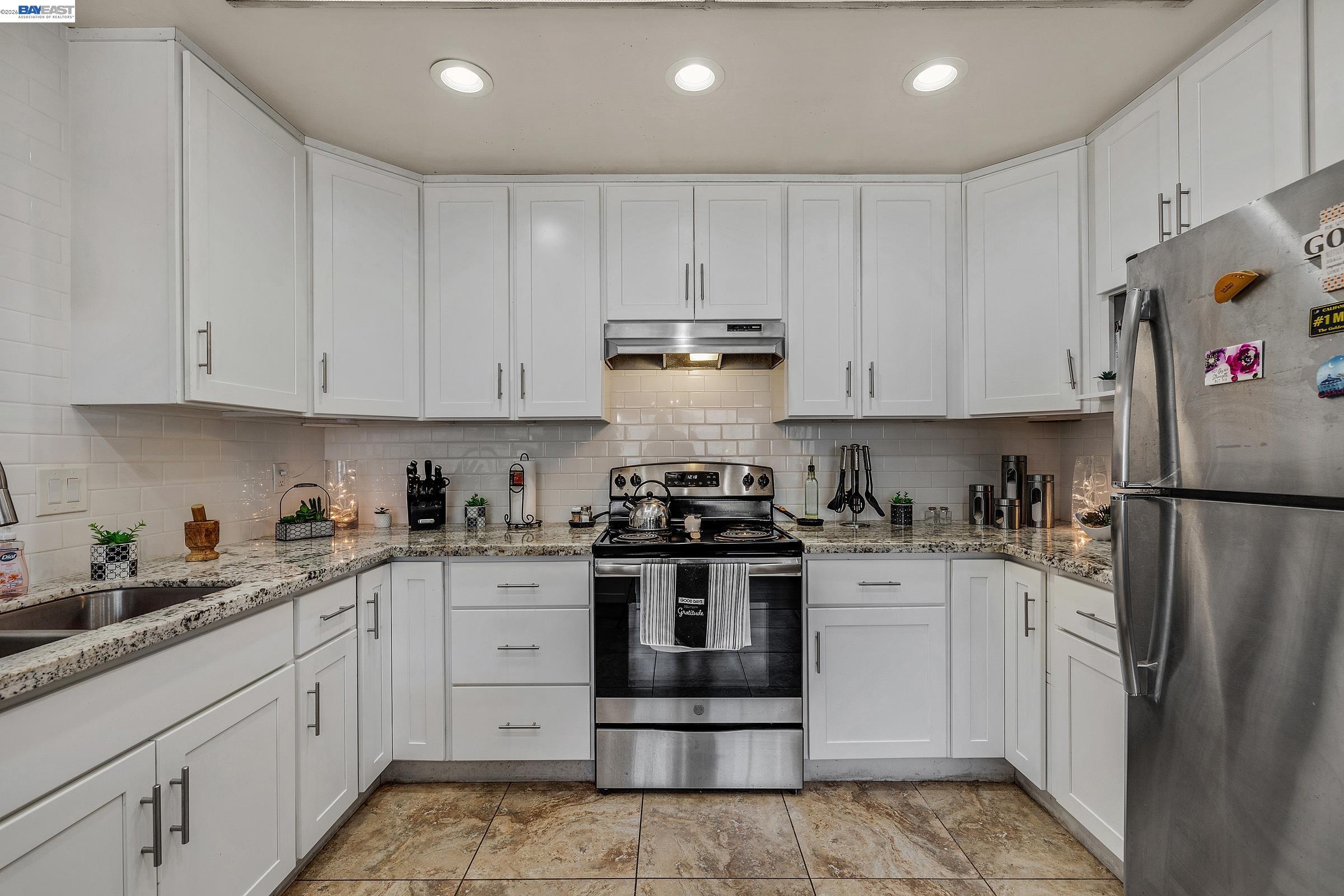 30236 Vanderbilt Street Hayward, CA 94544 - Photo 41 of 46 a kitchen with white cabinets and appliances