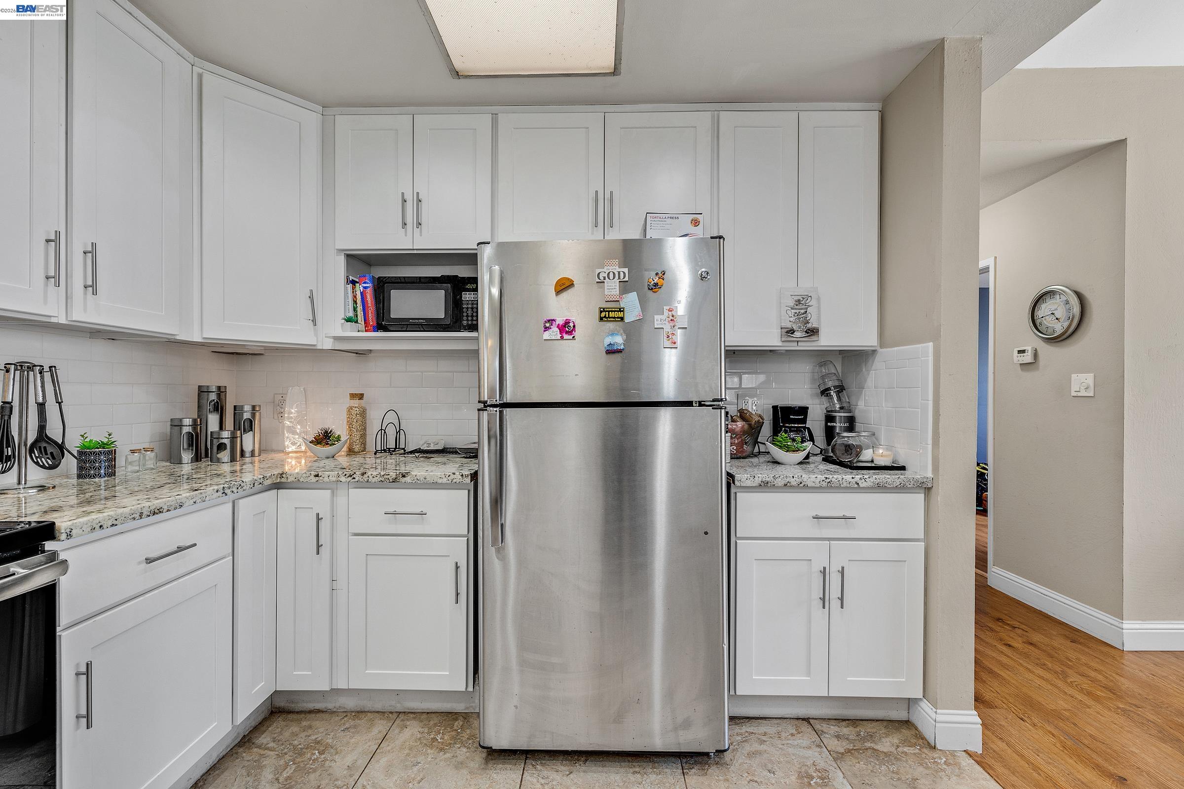 30236 Vanderbilt Street Hayward, CA 94544 - Photo 43 of 46 a kitchen with cabinets appliances a sink and a counter space
