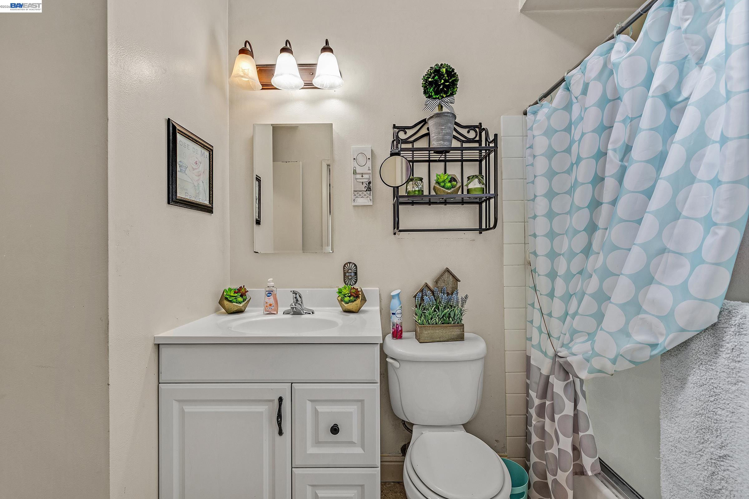 30236 Vanderbilt Street Hayward, CA 94544 - Photo 7 of 46 a bathroom with a toilet sink and mirror