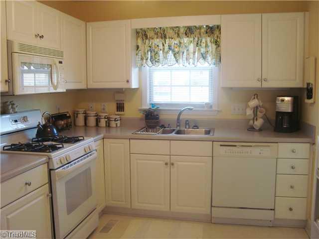 620 Hunters Knoll Road Winston-Salem, NC 27106 - Photo 2 of 16 Kitchen. Bright sunny kitchen with lots of cabinets and gas stove.