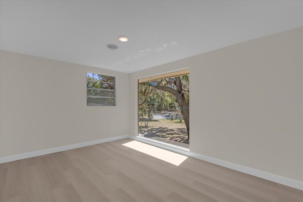 1610 Glenwood Road DeLand, FL 32720 - Photo 11 of 35 an empty room with windows