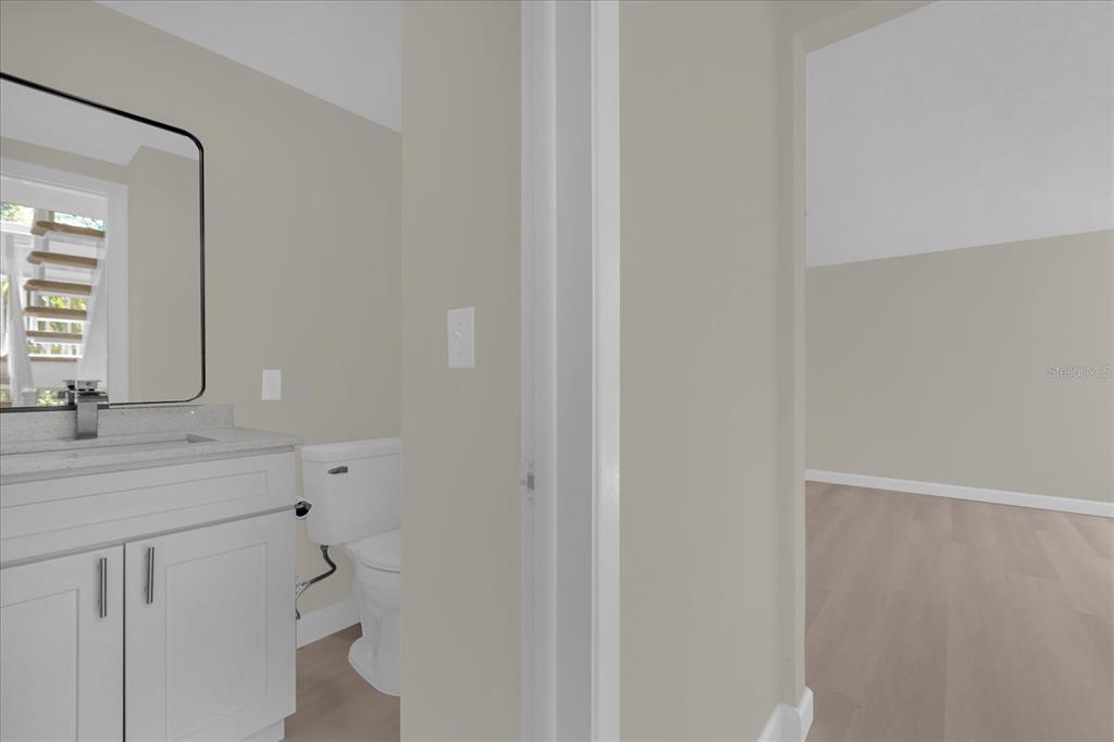 1610 Glenwood Road DeLand, FL 32720 - Photo 12 of 35 a bathroom with a sink and a mirror