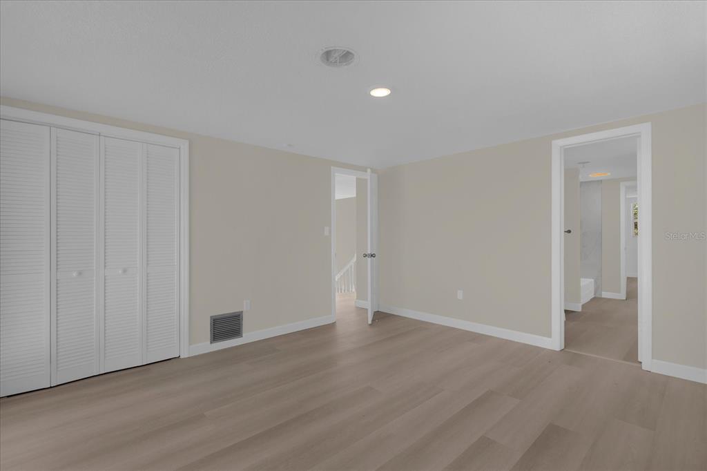 1610 Glenwood Road DeLand, FL 32720 - Photo 16 of 35 a view of an empty room with wooden floor