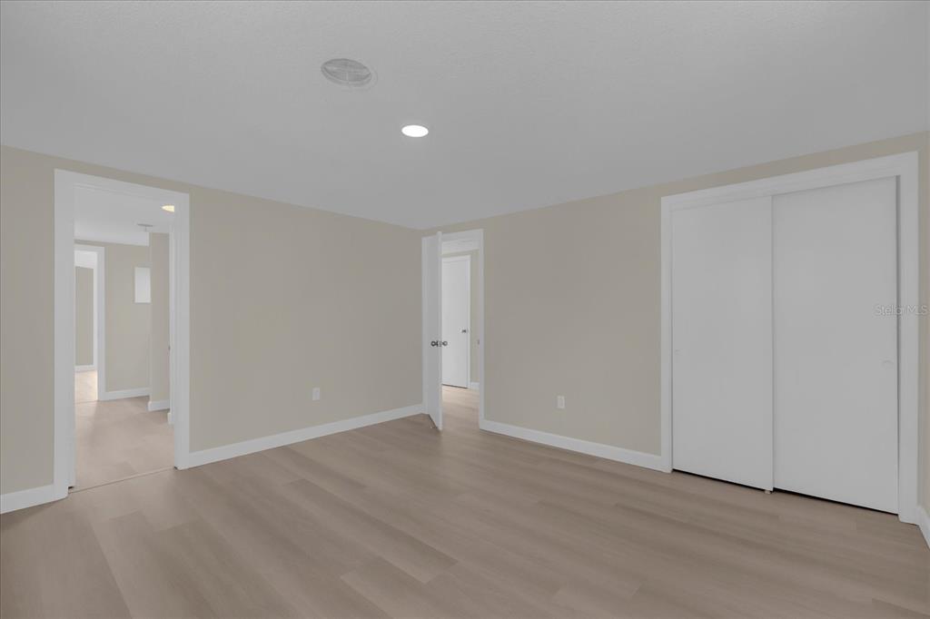 1610 Glenwood Road DeLand, FL 32720 - Photo 18 of 35 a view of an empty room with wooden floor