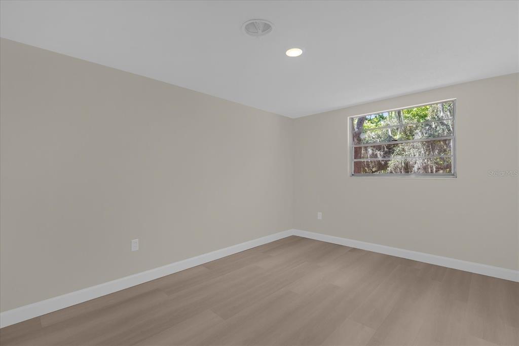 1610 Glenwood Road DeLand, FL 32720 - Photo 19 of 35 an empty room with a window