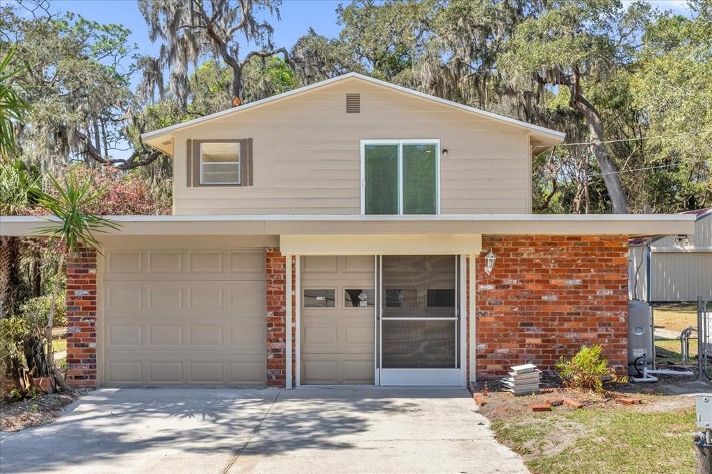 1610 Glenwood Road DeLand, FL 32720 - Photo 2 of 35 a front view of a house with garden