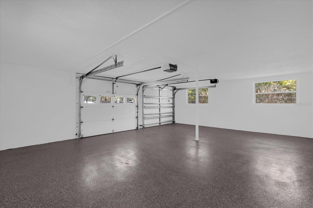 1610 Glenwood Road DeLand, FL 32720 - Photo 22 of 35 a view of a room with wooden floors and white walls