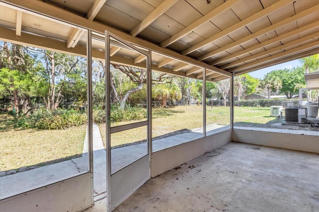 1610 Glenwood Road DeLand, FL 32720 - Photo 25 of 35 a view of an empty room with a large window
