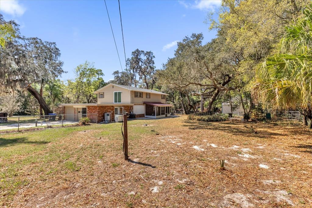 1610 Glenwood Road DeLand, FL 32720 - Photo 26 of 35 a house with trees in the background