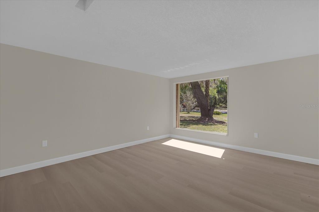1610 Glenwood Road DeLand, FL 32720 - Photo 8 of 35 an empty room with windows