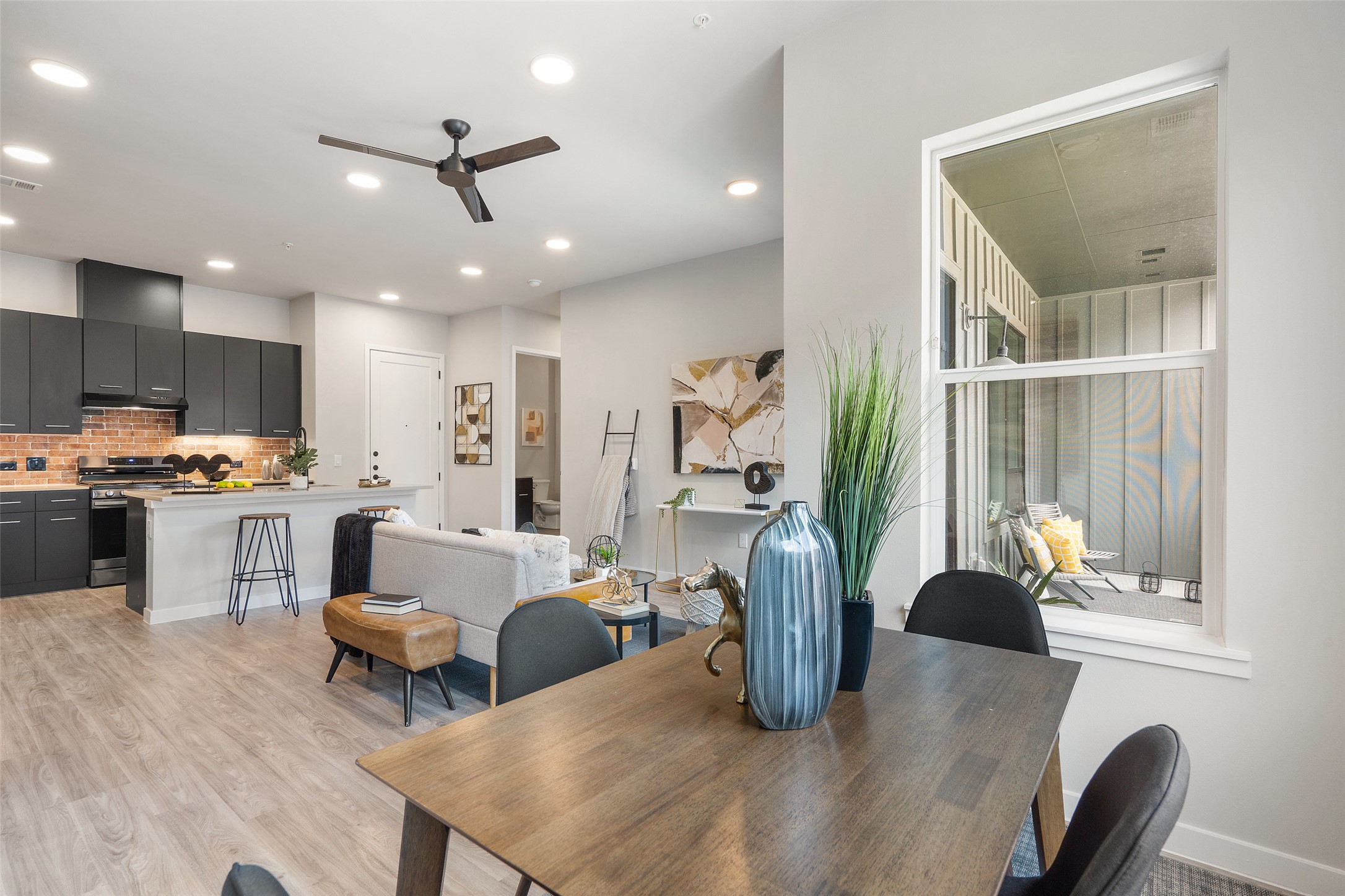 4510 Terry-O Lane, Unit 341 Austin, TX 78745 - Photo 23 of 40 Open concept living area featuring wood-look flooring, recessed lighting, and a view of the outdoor patio
