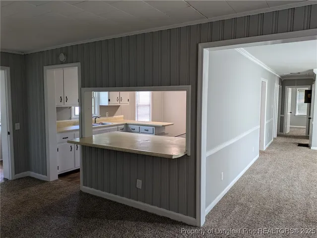 a kitchen with a sink and a refrigerator