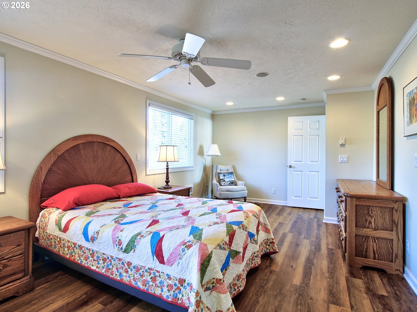 5185 Main Street Bay City, OR 97107 - Photo 21 of 48 a bedroom with a bed and wooden floor