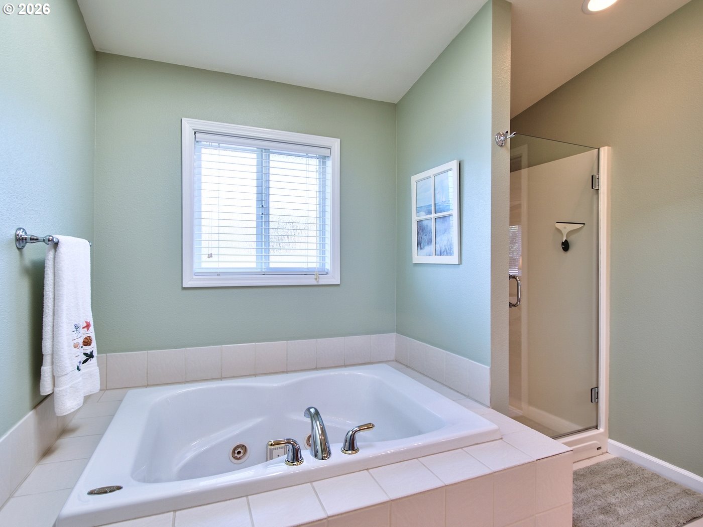 5185 Main Street Bay City, OR 97107 - Photo 24 of 48 a bathroom with a tub sink and a window