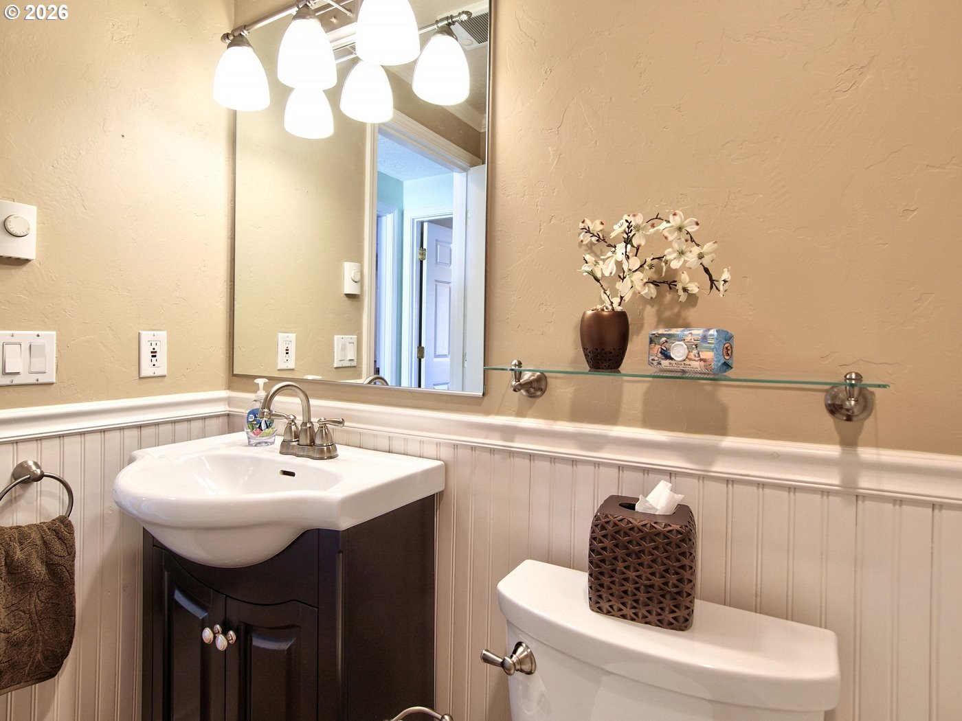 5185 Main Street Bay City, OR 97107 - Photo 29 of 48 a bathroom with a sink a toilet and a mirror