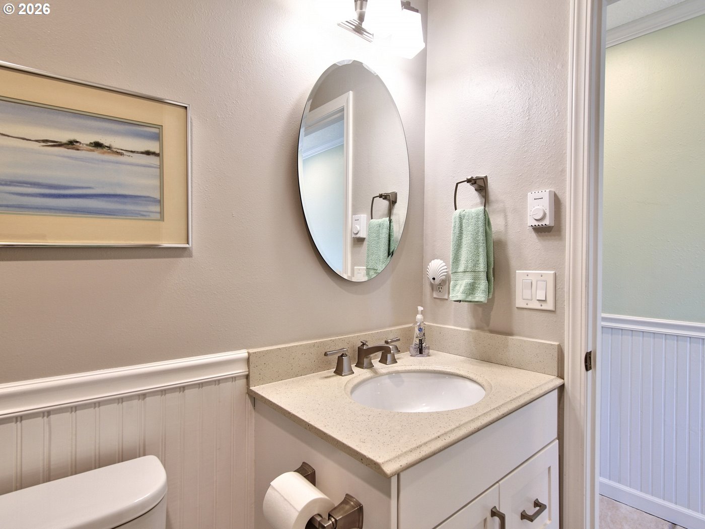 5185 Main Street Bay City, OR 97107 - Photo 36 of 48 a bathroom with a toilet sink and mirror
