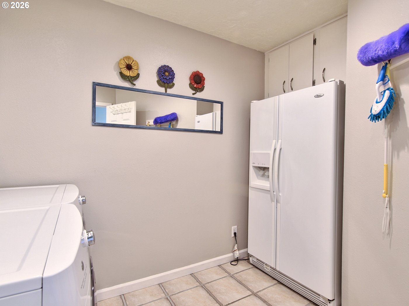 5185 Main Street Bay City, OR 97107 - Photo 38 of 48 a white refrigerator freezer sitting inside of a kitchen