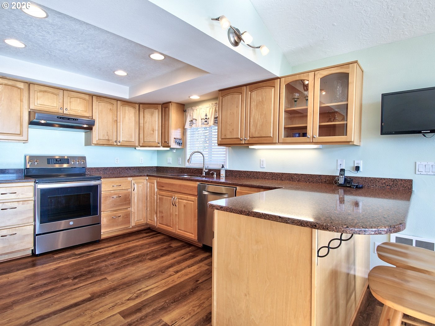 5185 Main Street Bay City, OR 97107 - Photo 6 of 48 a kitchen with a sink stove and cabinets