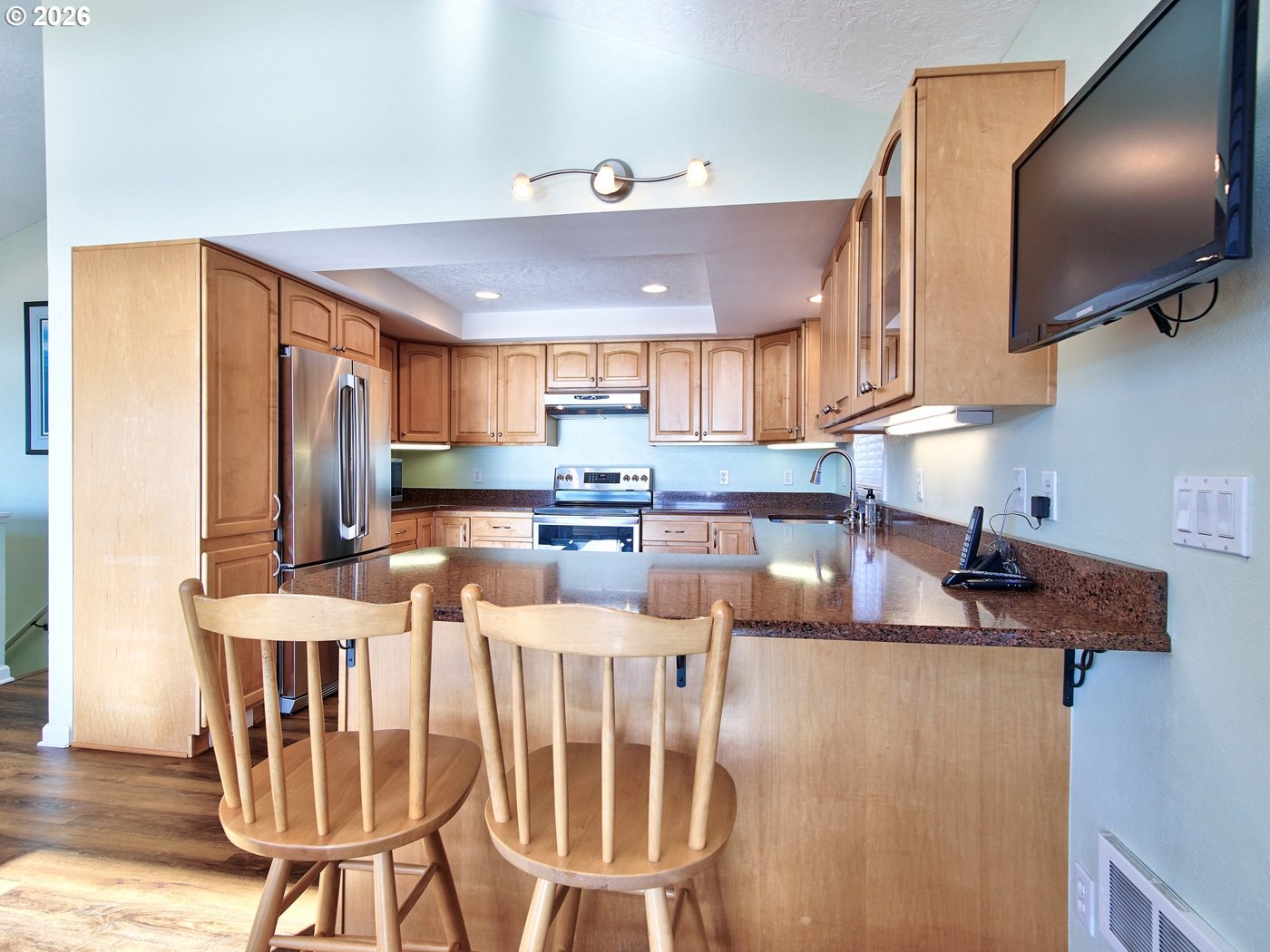 5185 Main Street Bay City, OR 97107 - Photo 7 of 48 a kitchen with stainless steel appliances granite countertop a sink refrigerator and cabinets