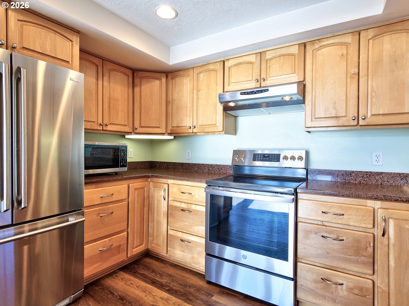 5185 Main Street Bay City, OR 97107 - Photo 8 of 48 a kitchen with stainless steel appliances granite countertop a refrigerator sink and cabinets
