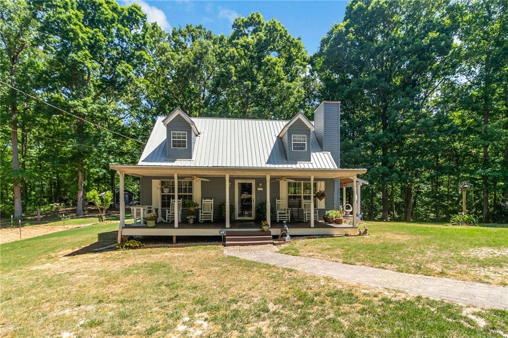 405 Hosannah Road Locust Grove, GA 30248 - Photo 1 of 1 a front view of a house with a yard
