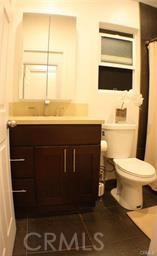 686 Atchison Street Pasadena, CA 91104 - Photo 7 of 11 a bathroom with a toilet a sink and a shower