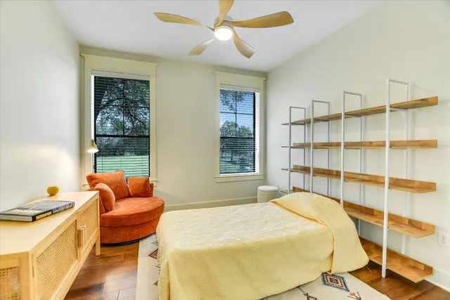 a bedroom with a bed and a couch