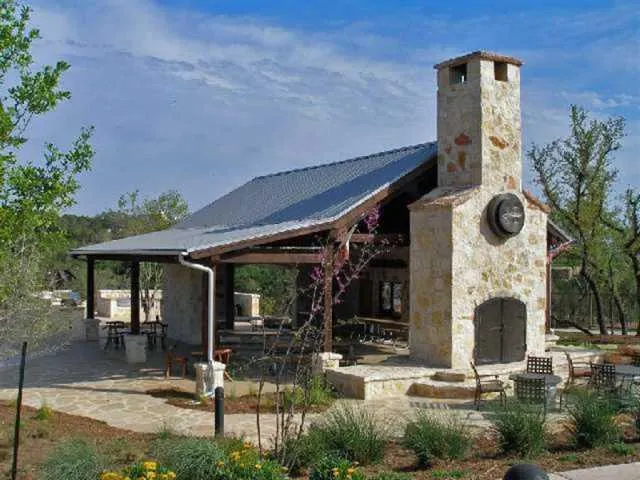 a front view of a house with garden and plants