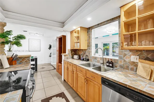 a living room with furniture wooden floor and large window