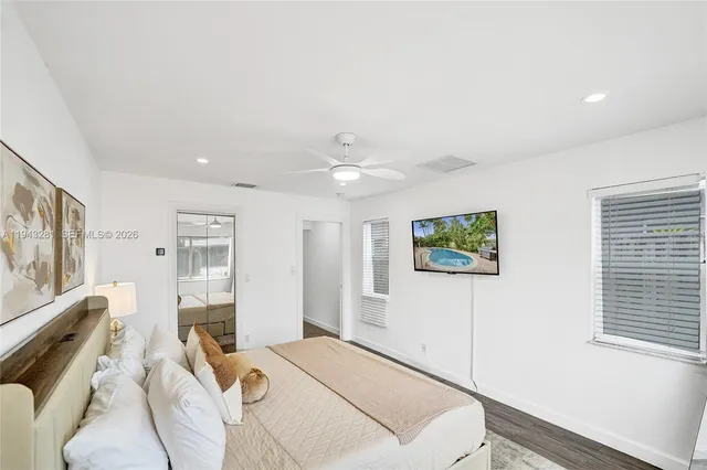 a bathroom with double sink and a mirror